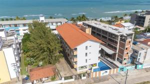 an aerial view of a city with the ocean at Flat Aconchegante c/ Piscina em Carneiros - FH105 in Tamandaré