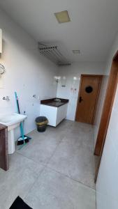 a bathroom with a sink and a counter in a room at Jacuipe beach house in Camaçari