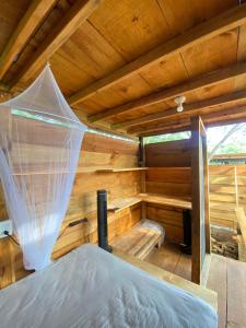 a inside of a sauna with a bed in it at Omnia puerto escondido in Malucano