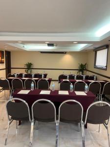 a conference room with a long table and chairs at Hotel Colonial Ciudad Juarez in Ciudad Juárez +22 photos