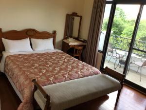 闕麒景觀民宿Chill Villa B&B客房内的一张或多张床位