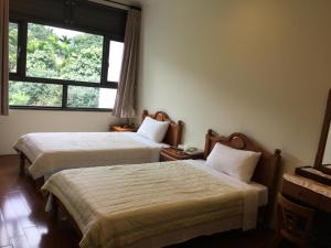 闕麒景觀民宿Chill Villa B&B客房内的一张或多张床位