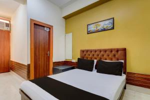 Ένα ή περισσότερα κρεβάτια σε δωμάτιο στο Hotel O The Grand Luxury