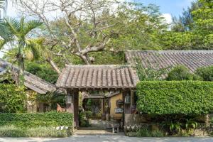 Vườn quanh 車で市街地近くの静かな田舎空間一沖縄古民家の宿