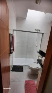 a small bathroom with a toilet and a shower at ZL Brasil in São Paulo +13 photos