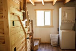 a small room with a refrigerator and a window at Sequoia Glen in Wilsonia +53 photos