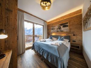 เตียงในห้องที่ Chalet in Neukirchen with ski access
