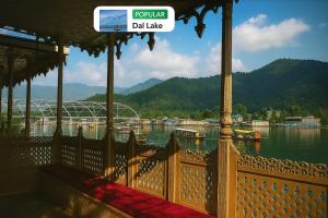 a porch with a view of a body of water at Nazneen Group Of Houseboats in Srinagar