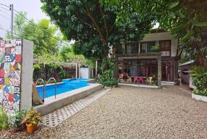 a house with a swimming pool in the yard at Zen Lian Private Resort in Lian