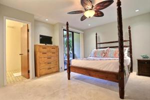 a bedroom with a bed and a ceiling fan at F 101 Kaanapali Royal Resort Ground Floor Upgraded Condo in Kaanapali