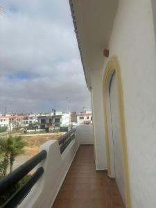 a balcony with a view of a building at New and cosy appt for rent in Sidi Rahal +1 photo