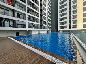a large swimming pool in the middle of a building at New Lavida in Dĩ An