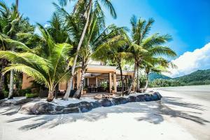 a house on a beach with palm trees on the beach at Blue Haven Bay Villas and Resort Apartments in Ko Chang +152 photos