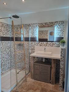 a bathroom with a sink and a shower at Studio Viggianello 2Pers in Viggianello +13 photos