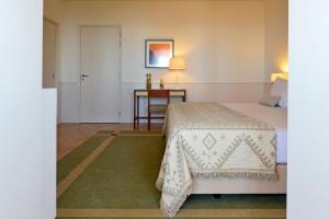 Cama ou camas em um quarto em Pousada da Serra da Estrela