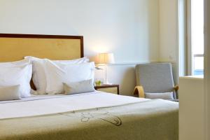Cama ou camas em um quarto em Pousada da Serra da Estrela