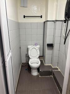 a bathroom with a toilet in a stall at Borneo Forest Sdn Bhd in Kota Kinabalu +15 photos