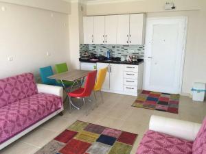 a living room with a couch and a table at Yasar Apart in Sinop