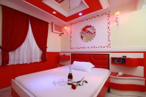 En eller flere senge i et værelse på Motel Sedução