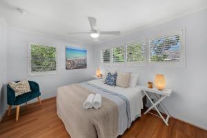 Кровать или кровати в номере Chez Noosa Holiday Apartments +26 фотографий
