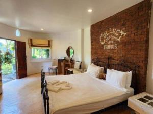 Ένα ή περισσότερα κρεβάτια σε δωμάτιο στο Ozono Resort +148 φωτογραφίες