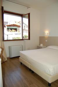 Postel nebo postele na pokoji v ubytování Hotel Nettuno
