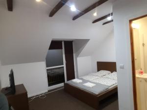 Posteľ alebo postele v izbe v ubytovaní Spa Apartamenty Lidzbark