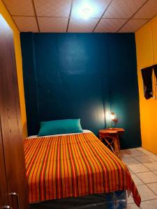 Postel nebo postele na pokoji v ubytování Expresión cultural restaurante y alojamiento