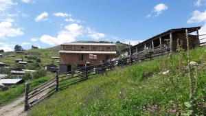 a train sitting on top of a hill at Guesthouse Javakhe in Omalo +18 photos