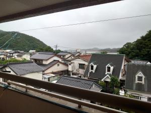 a view from a balcony of houses at 民宿たけだ家 in Saka