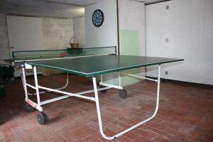 a green ping pong table in a room at L'O de La Roche in La Roche-en-Ardenne