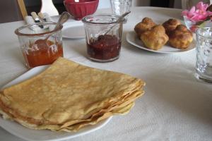 a plate of food with a tortilla on a table at Chambres d'hôtes de Ty Guen in Trédarzec +19 photos