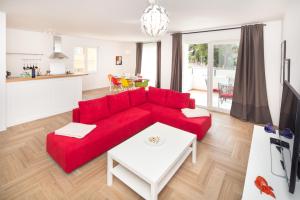 TV a/nebo společenská místnost v ubytování Apartments Tamburini