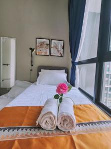 Ένα ή περισσότερα κρεβάτια σε δωμάτιο στο IOI Conezion Putrajaya