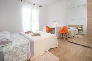 Postel nebo postele na pokoji v ubytování Apartments Tamburini