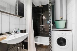 a bathroom with a sink and a washing machine at JB162-Fjerritslev-Ronnevej-4 in Fjerritslev +19 photos