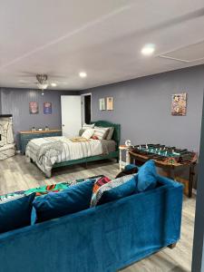 a living room with a couch and a bed at Private Oasis in the Mountains in Oroville