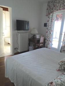 Postel nebo postele na pokoji v ubytování B&B Le Palme