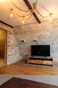 Μια τηλεόραση ή/και κέντρο ψυχαγωγίας στο Cabanele Zenhouse