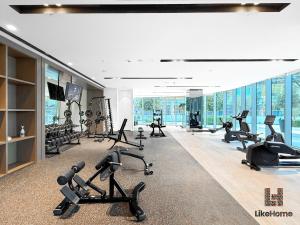 a gym with treadmills and exercise equipment in a building at Luxury 2BR Beside Burj Khalifa & Dubai Mall Enjoy Dubai Skyline From Balcony Like Home in Dubai
