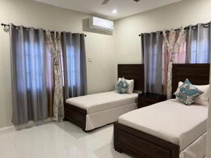 Ένα ή περισσότερα κρεβάτια σε δωμάτιο στο hideawaydayz