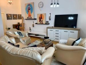 TV a/nebo společenská místnost v ubytování Art Loft Baden-Baden