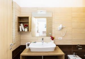 a bathroom with a sink and a mirror at Detached villa with 2 bathrooms in Lupetto +12 photos