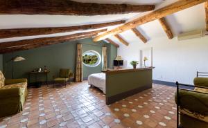 a bedroom with a bed in a room with wooden beams at Relais Regina Giovanna in Sorrento