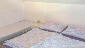 Postel nebo postele na pokoji v ubytování Rekreačný dom Ruža