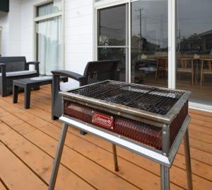 a grill sitting on top of a deck at PiPi Vacation Rental in Ichinomiya