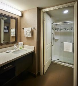 a bathroom with a sink and a shower at Staybridge Suites Hamilton - Downtown, an IHG Hotel in Hamilton