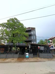 a building on the side of a street at The Rabbit Hole Hotel Sok San in Siem Reap