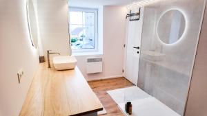 a white bathroom with a shower and a toilet at El Sart in Sart-lez-Spa +21 photos