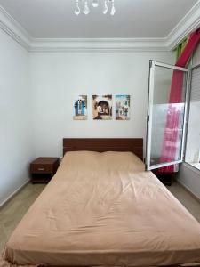 Katil atau katil-katil dalam bilik di Sea View Blue Mahdia Apartment2